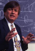 Richard Tapia in front of a blackboard